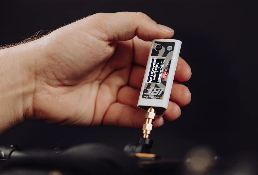 Close-up of a hand operating with the ImmersionRC v2 product
