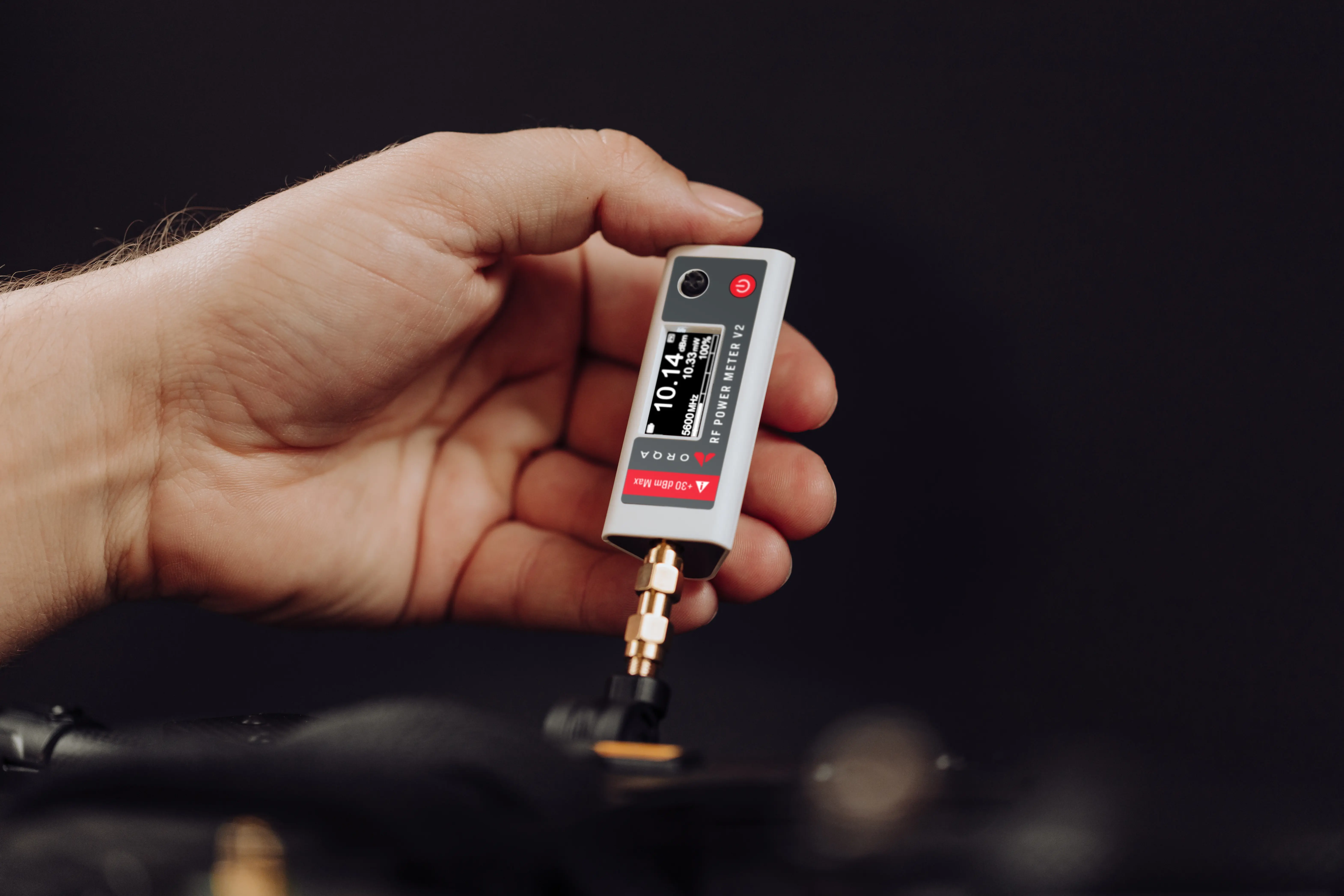 Close-up of a hand operating with the power meter version two product